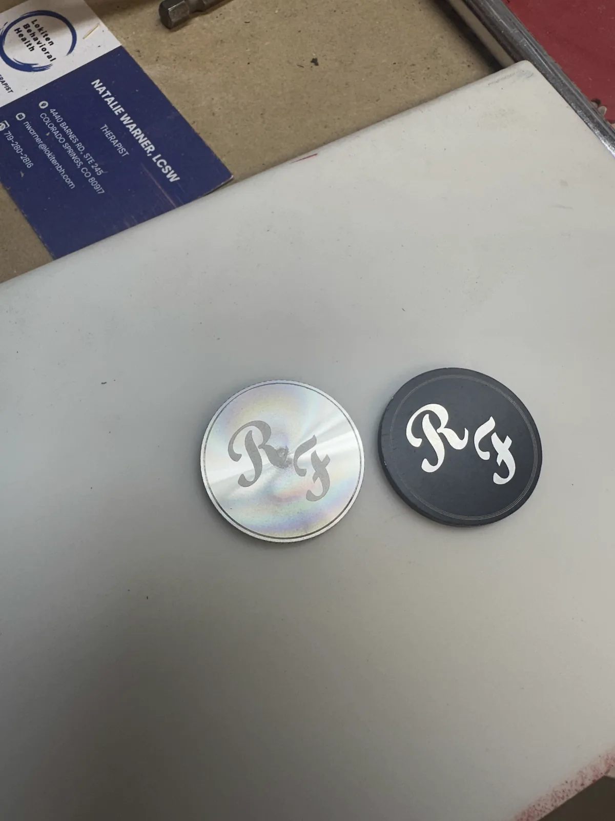 RF monogram engraved into a set of coins